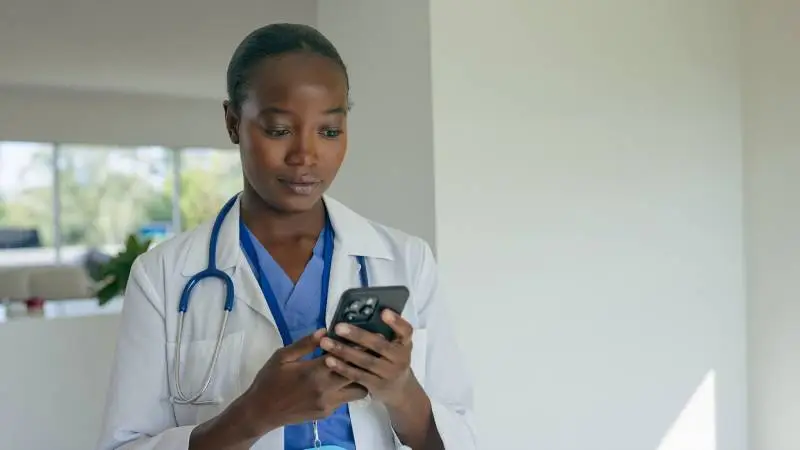 image of a nurse holding a phone